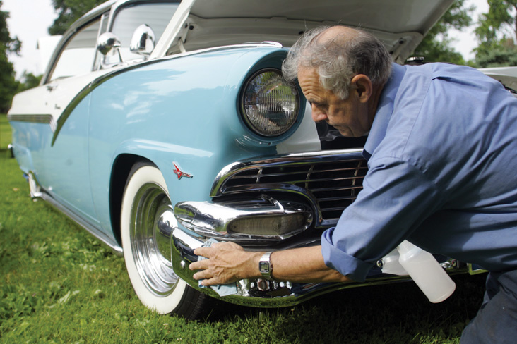 man cleaning his car for the Car Show